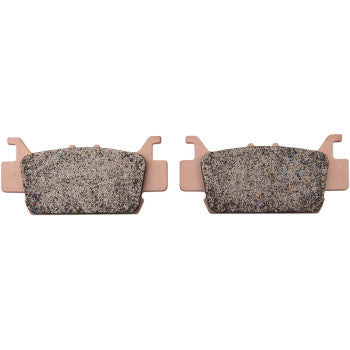 Pair of rectangular copper-colored brake pads with textured gray friction surfaces and small mounting tabs on each end.