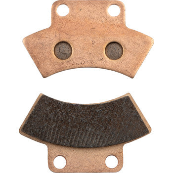 Two Sintered Brake Pads by All Balls are shown: one has a smooth, copper-colored surface with two circular indents and holes, while the other features a dark, textured friction surface designed for long life performance.