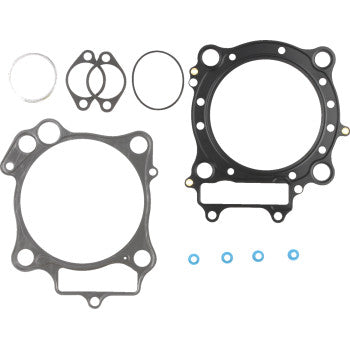 The Honda Top End EST Gasket Kit 96 mm by Cometic features MLS head gaskets with Extreme Sealing Technology, several small round seals, and four blue ring gaskets—all displayed on a white background.