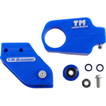 The Yamaha Chain Guide Slider Blue by T.M. Designworks includes a rear chain guide, powerlip roller, two main parts with logos, a bearing, washers, O-rings, and a bolt—displayed on a white background.
