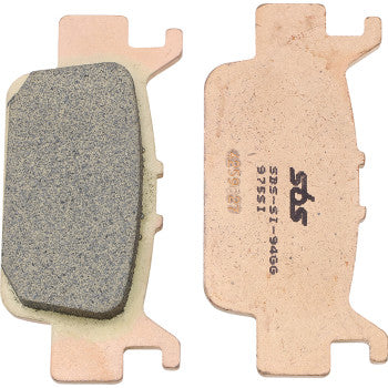 Copper-colored metal off-road sintered brake pads with a textured friction surface and SBS branding on the back.