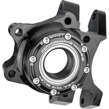 Black metal wheel hub bearing carrier with circular central bearing and multiple bolt holes.