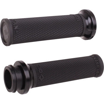 Two Indian Ruffian Lock-On Grips - TBW in Black/Black by Odi, shown from different angles, feature flared ends and a diamond-patterned texture to increase grip and comfort.