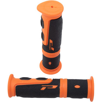 Two 964 Evo Grips Orange / Black by Pro Grip are shown—one upright and one horizontal—displaying their ergonomic design, raised grip patterns, and durable rubber-compound inner layer for 7/8 handlebars.