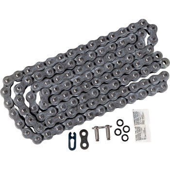 A 520 SRX2 Drive Chain 112 Links by Ek is laid out flat with connecting links, pins, and a small packet of lubricant or grease arranged below it.