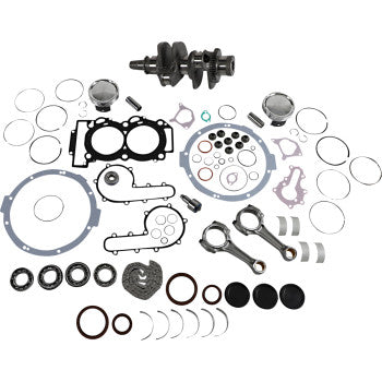 Complete Polaris engine rebuild kit with crankshaft, pistons, gaskets, seals, and bearings arranged on white background.