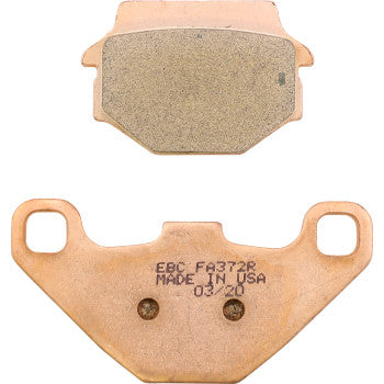 Rectangular copper brake pad with tan friction surface and copper backing plate marked with “EBC FA372R Made in USA 03/20”.