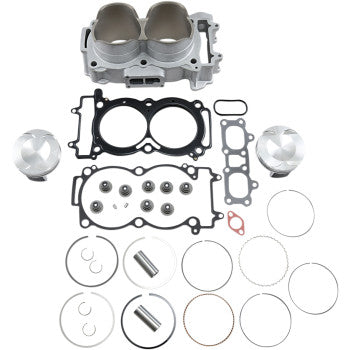 Silver dual-cylinder engine block with black gaskets, two silver pistons, metal rings, and small engine components arranged.
