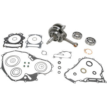 The Yamaha Crankshaft Kit OE Crankshaft Replacement by Hot Rods includes a crankshaft, Hot Rods connecting rod, gaskets, bearings, and assorted seals arranged on a white background, designed to meet OEM specifications.