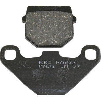 Two black Sport Carbon Brake Pads by Ebc are shown: one displays the speckled friction surface, while the other reveals the back plate marked FBC FA334 MADE IN UK in white.