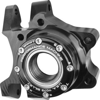 Glossy black metal wheel hub bearing carrier with circular central bearing and mounting points.
