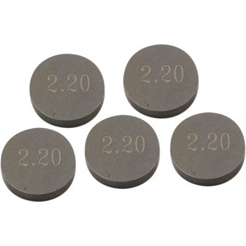 A pack of five Prox Valve Shims (9.48 mm x 2.20 mm), each precision machined and engraved with "2.20" on the top, are loosely arranged on a white background.