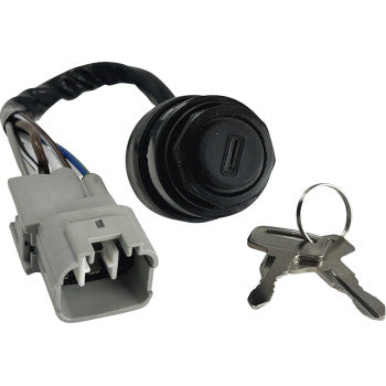 Black circular ignition switch with attached wiring harness and gray plastic connector, includes two silver keys with round.