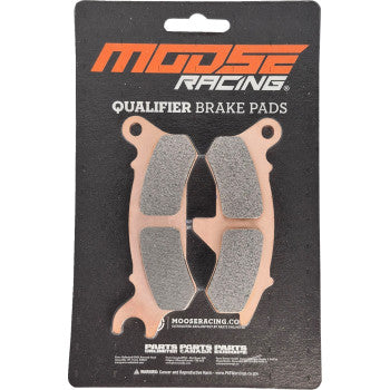 Moose Racing front right brake pad set with copper-colored backing and gray friction material on black card packaging.