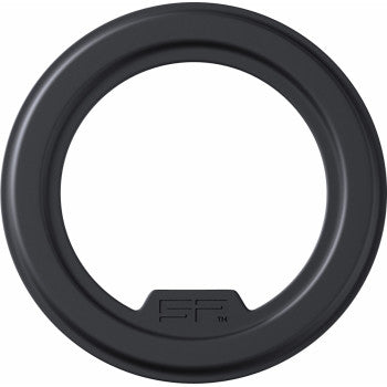 A black, circular plastic ring with a smooth matte finish and embossed tab, the Phone Mount Magnetic Adhesive SPC+ Pair by Sp Connect enables secure magnetic attachment to SPC+ Phone Case systems and compatible magnetic mounts.