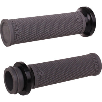 The Indian Ruffian Lock-On Grips - TBW - Graphite / Black by Odi are shown from different angles on a white background, featuring black and gray textured surfaces with flared ends inspired by the Ruffian Lock-On Street Grips.