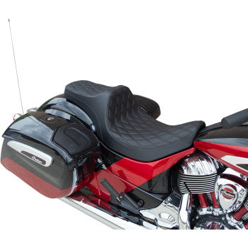 Black vinyl motorcycle seat with double diamond stitching on a red bike with chrome engine accents.