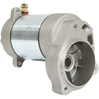 A silver metallic cylindrical Starter Motor by Parts Unlimited with mounting flanges, copper bushings, and electrical connections—high-quality OEM part—displayed on a plain white background.