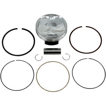 The Honda Piston Kit 96.00 mm by Wiseco includes a silver forged piston, piston pin, two circlips, and five assorted 4-stroke rings, all arranged neatly on a white background.