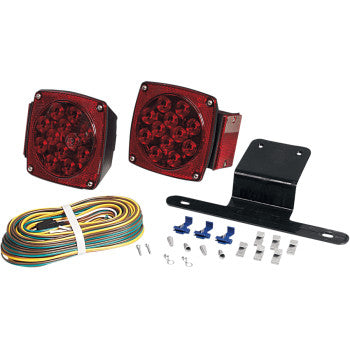 The LED Trailer Light Kit Waterproof by Optronics Inc. includes two red square stud-mount taillights, a black mounting bracket, coiled wiring harness, and assorted connectors and screws, all displayed on a white background.