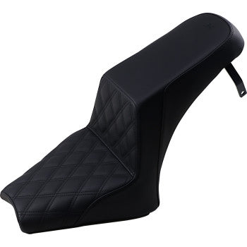 Black motorcycle step-up seat with front lattice stitch pattern and smooth rear section.