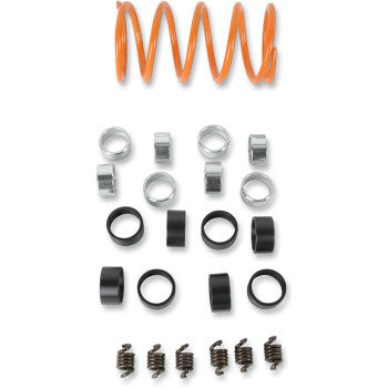 Orange coil spring with multiple black clips and small metal springs arranged below on a white background.