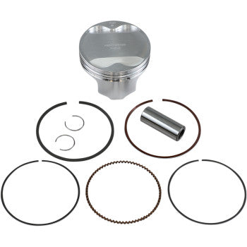The Kawasaki Piston Kit 85.00 mm by Wiseco includes a forged piston, piston rings, wrist pin, and two circlips—key engine performance parts—displayed neatly on a white background.