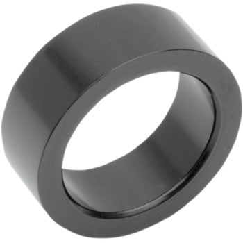 A solid black cylindrical Contour Handlebar Control Spacer for 1 handlebars by Performance Machine, designed for left cable clutch setups, is shown at an angle on a white background with smooth surfaces.