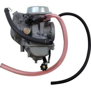 Compact silver metal carburetor with attached black and pink fuel hoses and fittings.