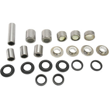Assorted silver metal bushings and black rubber O-rings of varying sizes arranged in rows on a white background.