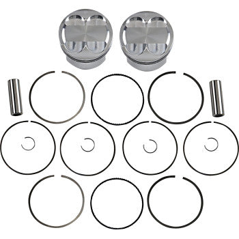 The Piston Kit by JE Pistons includes two forged aluminum pistons with matching wrist pins, circlips, and piston rings, all arranged neatly in rows on a white background.