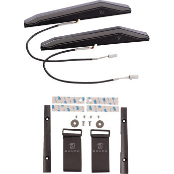 Pair of slim white LED running lights with black mounting brackets and wiring connectors, accompanied by adhesive strips and