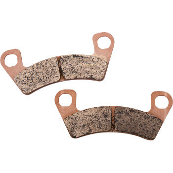 Pair of curved, copper-colored brake pads with textured friction surfaces and mounting holes.