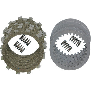 The Clutch Kit by DP Brakes includes fiber friction plates on the left, steel drive plates on the right, and three coiled springs positioned between them, all arranged neatly on a white background.