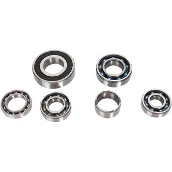 Six metal ball bearings of various sizes are arranged on a white background, representing the Transmission Bearing Kit by Hot Rods, commonly used for engine case installation and transmission repairs. Some bearings are exposed while others are fully enclosed.