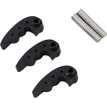 Three black, curved Clutch Weights 66g to 82g by Bikeman Performance, each with holes and finger grooves, are lined up beside a stack of small silver metal rods on a white background.