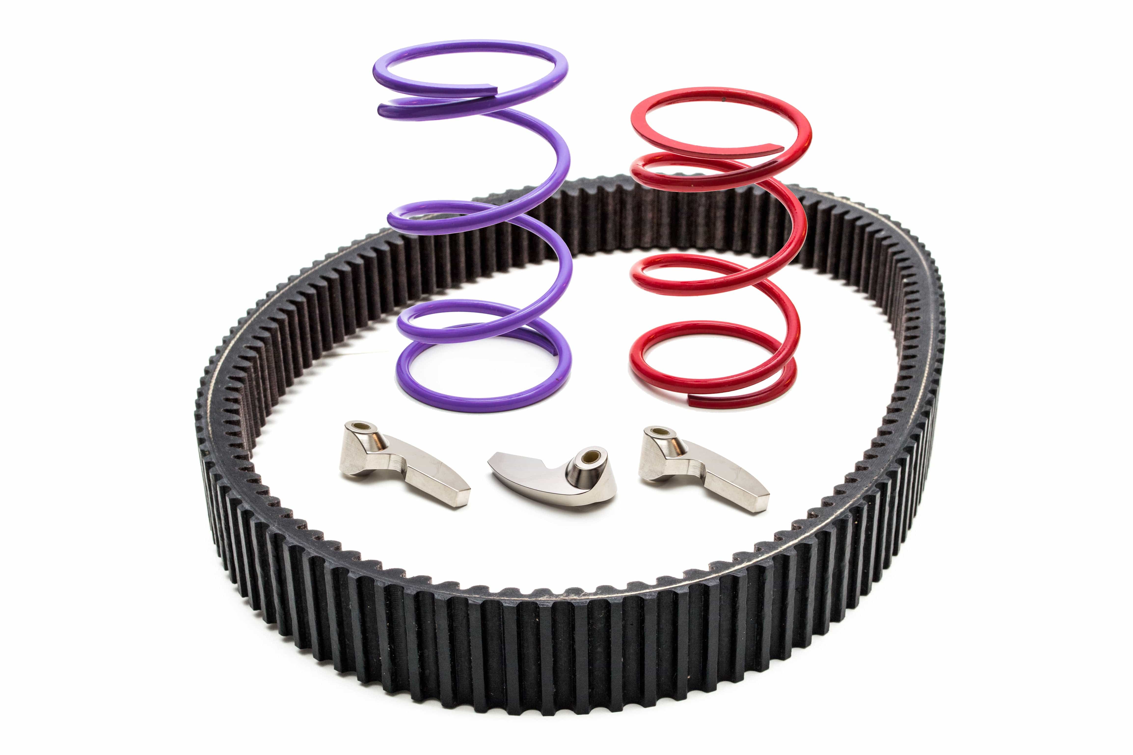 A Clutch Kit For Polaris Rzr Pro Xp (0-3000) Stock To 32 Tires (21-23) by Trinity Racing, including a black drive belt, two metal cam weights, and two coiled springs (red and purple), is displayed on a white background.