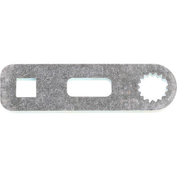 The Shift Lever Bell Crank by Quad Logic is a flat, zinc-plated metal tool with a rectangular body, featuring left square, center rectangular, and right toothed round cutouts for easy installation.