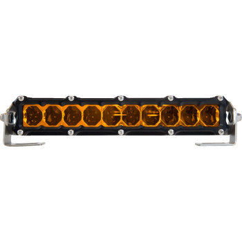 The Light Bar 10" Flood Amber by Heretic features a row of yellow-orange LEDs in a black housing, mounted on stainless steel brackets and viewed from the front.
