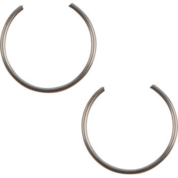 Two silver metal piston circlips with open-ended circular shapes designed for secure fitment in mechanical assemblies.