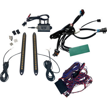 The Polaris RZR Turn Signal Kit Front & Rear by Custom Dynamics includes LED light strips, wiring harnesses, connectors, a control box, screws, zip ties, and a run/brake/turn module displayed on a white background.