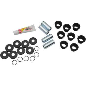 Set of metal cylindrical bearings, black rubber bushings, washers, small metal rings, and a tube of lubricant on white.