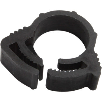 The Clamps Ratchet Nylon 100 Piece by Moose Offroad are black, circular plastic clamps with a toothed inner surface and quick release design for securing hoses or cables.