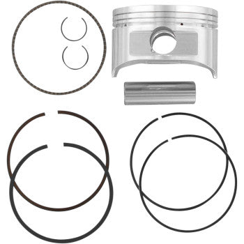 The Honda Piston Kit 85.00 mm by Wiseco, featuring a forged 4-stroke piston, piston rings, circlips, and a piston pin, is displayed neatly on a white background.