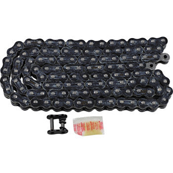 The 520 Max Z Drive Chain 120 Links Black & Chrome by RK is displayed coiled with a connecting master link and a small packet of lubricant beside it, all set against a white background.
