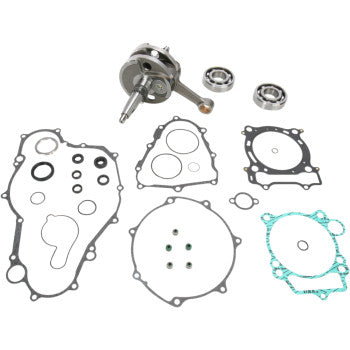 The Yamaha Crankshaft Kit OE Crankshaft Replacement by Hot Rods includes gaskets, seals, a crankshaft, and two ball bearings—engineered to OEM specs—neatly displayed on a white background.