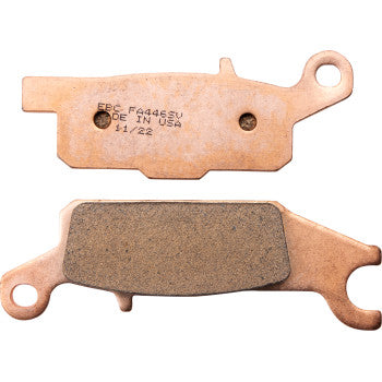 Two SV Severe Duty Brake Pads by Ebc are shown—one displays the friction surface, while the other is flipped to reveal a stamped label featuring text such as MADE IN USA.