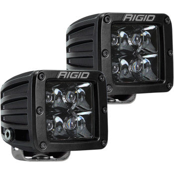 The D-Series Spotlight Pair by Rigid Industries includes two black, square LED pods with four LEDs each and midnight optics for enhanced visibility, ideal for off-road or automotive lighting.