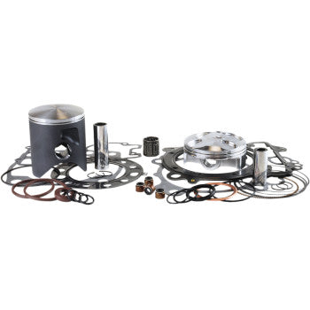 Yamaha Banshee piston kit with gray piston, silver rings, gaskets, and assorted metal components arranged on white.
