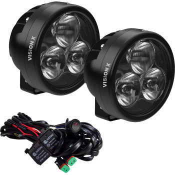 The Light Cannon Driving Beam Clear Lens by Vision X features round black high-output LED lights and is shown with a wiring harness, connectors, and switch for easy installation.